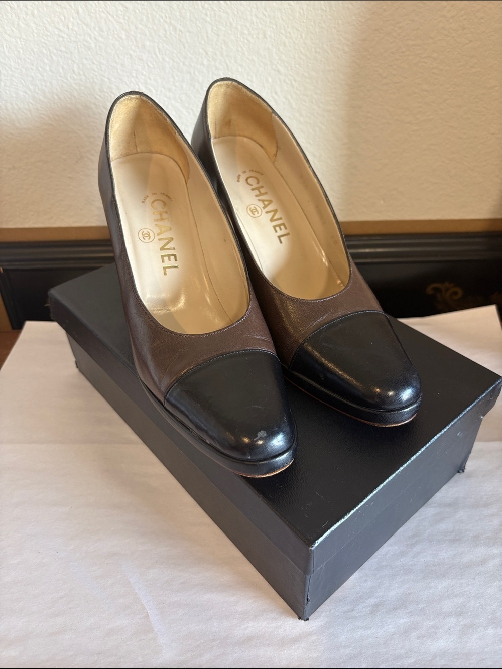 CHANEL Two-Tone Brown and Black Leather Cap-Toe Pumps